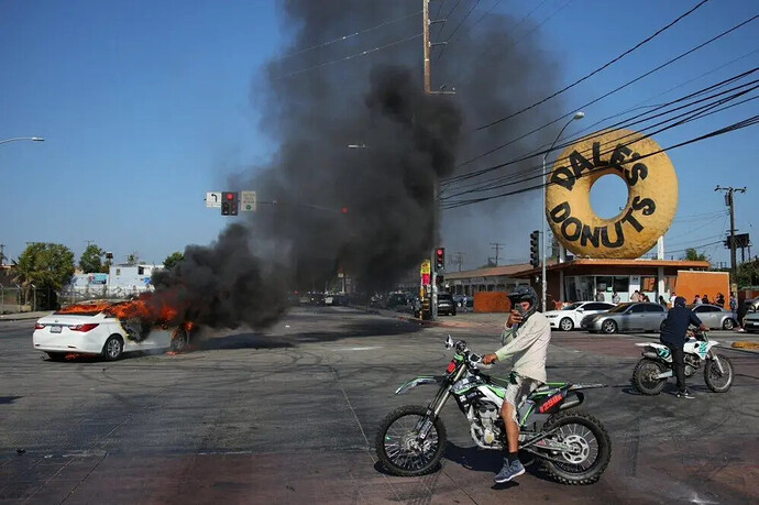 Initial Los Angeles uprising, allegedly involving ICE vehicle fires