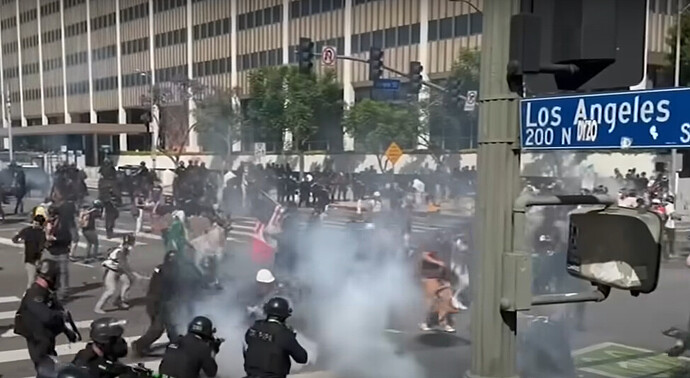 Los Angeles police firing tear gas and rubber bullets at protesters during the "No Kings" march. Protest organizers estimate 200,000 demonstrators participated